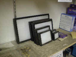 Glass-topped Riker mounts, filled with white cushi