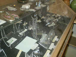 Assorted easel stands for slabs and minerals.