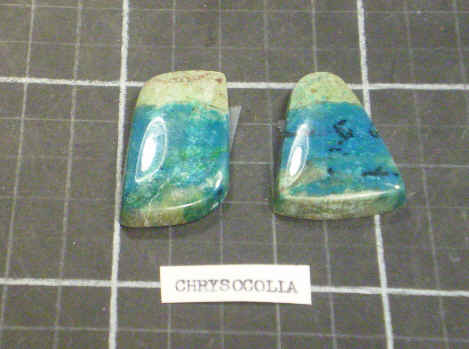 Freeform cabochons of chrysocolla.