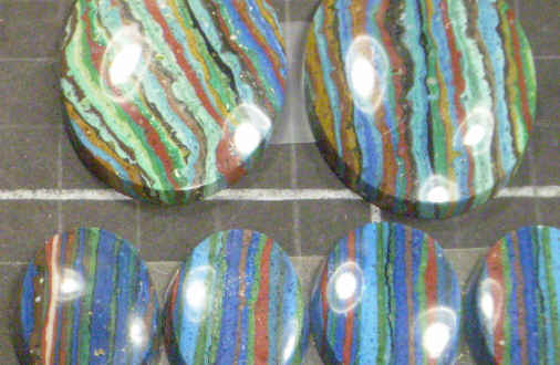 Cabochons of rainbow calsilica.